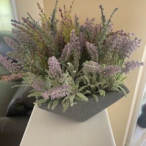 Fake flower, purple lavender, has a tiny chip on the corner of pot as pictured